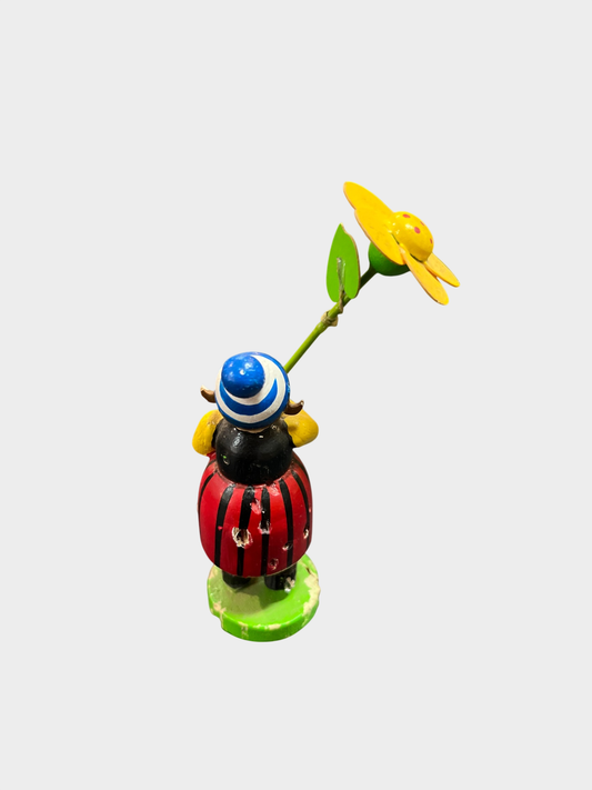 Otto Mertens Holzfigur Blumenkind mit gelber Blume handbemalt defekt